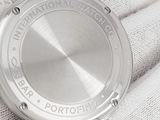 a close up of a wrist watch on a glove