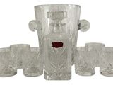 four glasses and a decanter on the table