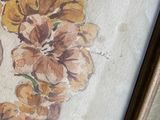 a picture of a painting of flowers on the wall