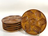 four plates that are sitting on top of each other