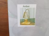 a box with a picture of a lamp inside of it