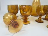 a lot of glass items that are sitting on a table