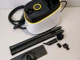 a close up of a yellow and black vacuum cleaner on a table
