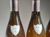 three bottles of wine sitting next to each other on a table