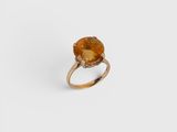 an image of a ring with a large citrine stone on it