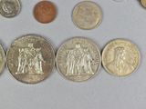 a lot of coins that are on the table