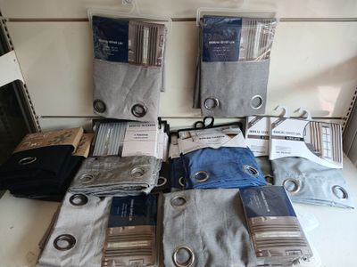 many different types of men ' s clothing displayed on the counter