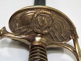 a close up of a sword with a lion on it