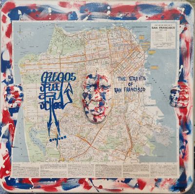 peinture représentant une carte d'une ville sur laquelle figure un visage