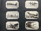 several black and white photos of airplanes on display in a book