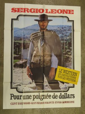 movie poster of a man in a cowboy outfit holding a gun