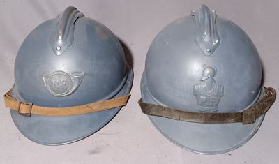 these are two helmets that are sitting on top of a table