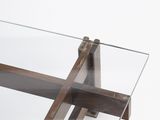 a glass table with a metal frame and a glass top