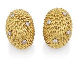 a pair of gold and diamond earrings