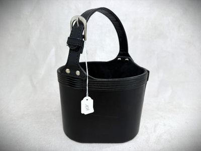 a small black bucket with a tag on it