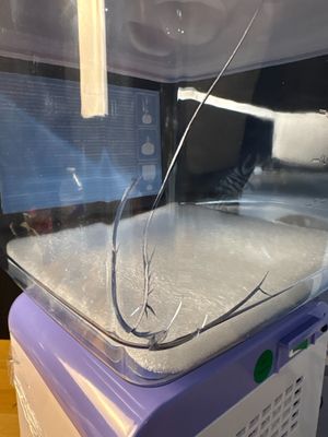 a machine that has broken glass on top of it