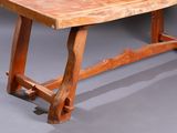 a wooden table that is sitting on a gray surface
