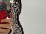 a woman taking a picture of herself in a mirror