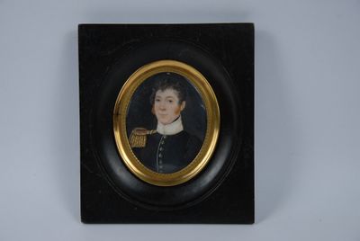 a miniature portrait of a boy in a black coat and white collar