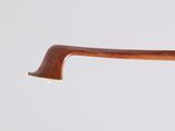 a close up of a wooden stick with a handle on a white background