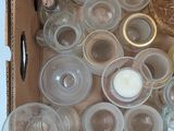 a box full of empty glasses and bottles on a table