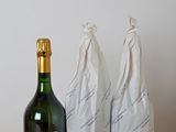 three bottles of wine sitting next to each other on a table