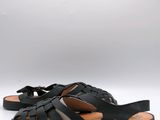 a pair of black sandals with straps and a bow on the toe