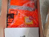 a cardboard box with a bunch of orange items in it