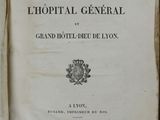an open book with a picture of a coat of arms on it
