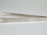 a pair of scissors sitting on top of a white table