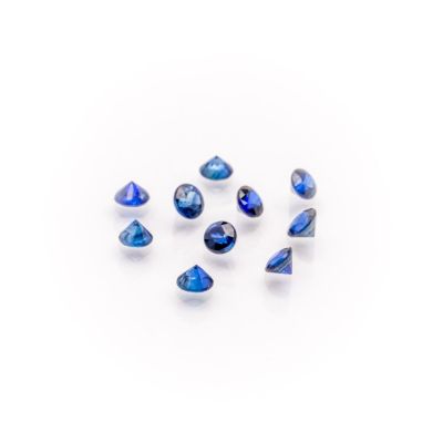 a group of blue sapphires on a white background