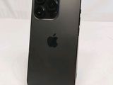 an apple iphone is sitting on top of a stand on a white surface