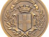 a close up of a gold coin with a crown on it