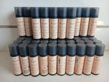 many bottles of makeup sitting on a shelf