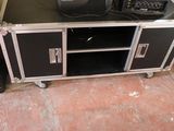 a television sitting on top of a black entertainment center