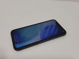 a close up of a cell phone on a table with a white background