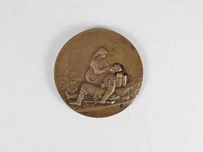 une image représentant une médaille d'or sur laquelle figurent un cheval et son cavalier