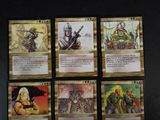 the four cards have different designs on them, including a dragon, a knight, and a dragon