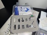 a box of sewing machines sitting on top of a table