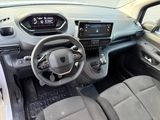 the interior of a small car with a steering wheel and dashboard