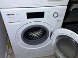 a washer and a dryer in a small room