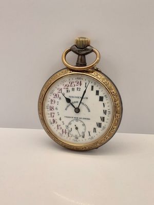 une montre de poche en or avec des chiffres romains