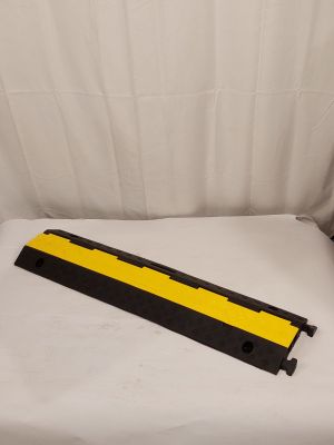 a yellow and black rail on a white sheet