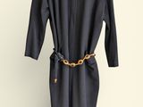 an image of a black dress hanging on a hanger