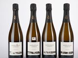 trois bouteilles de vin posées l'une à côté de l'autre sur une table