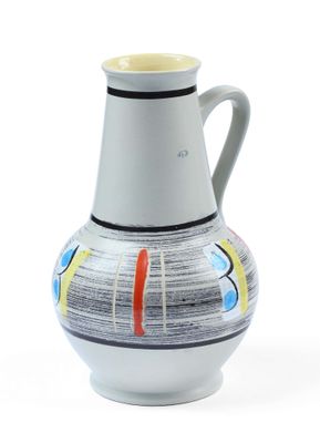 a white vase with a multicolored design on it