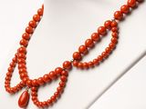 a close up of a necklace on a mannequin mannequin