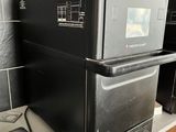 a microwave sitting on top of a counter in a kitchen