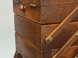 a small wooden box with a mirror on top of it