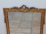 a mirror that is sitting on the floor in front of a wall